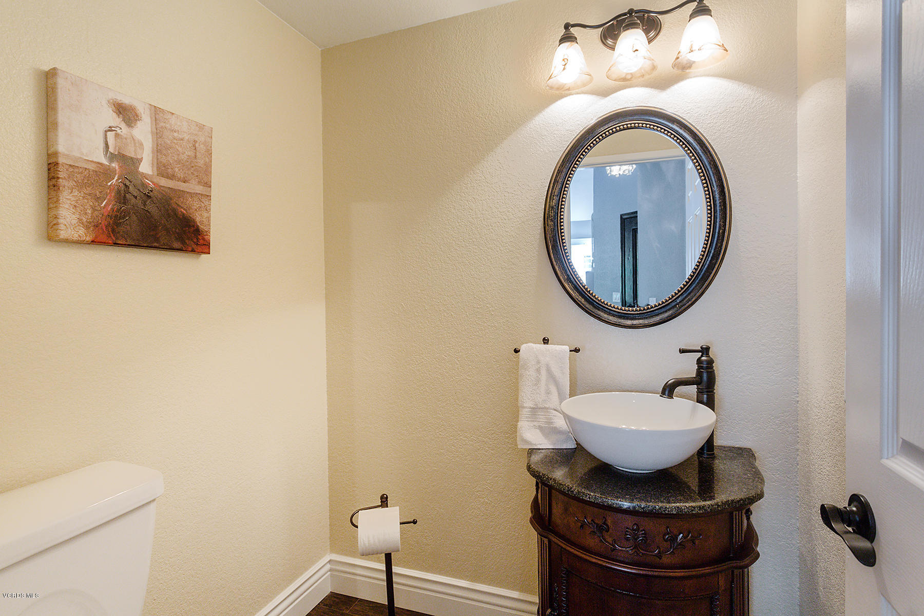 15317 Rains Court Moorpark, CA 93021 - Photo 15 of 34 a bathroom with a sink and a mirror