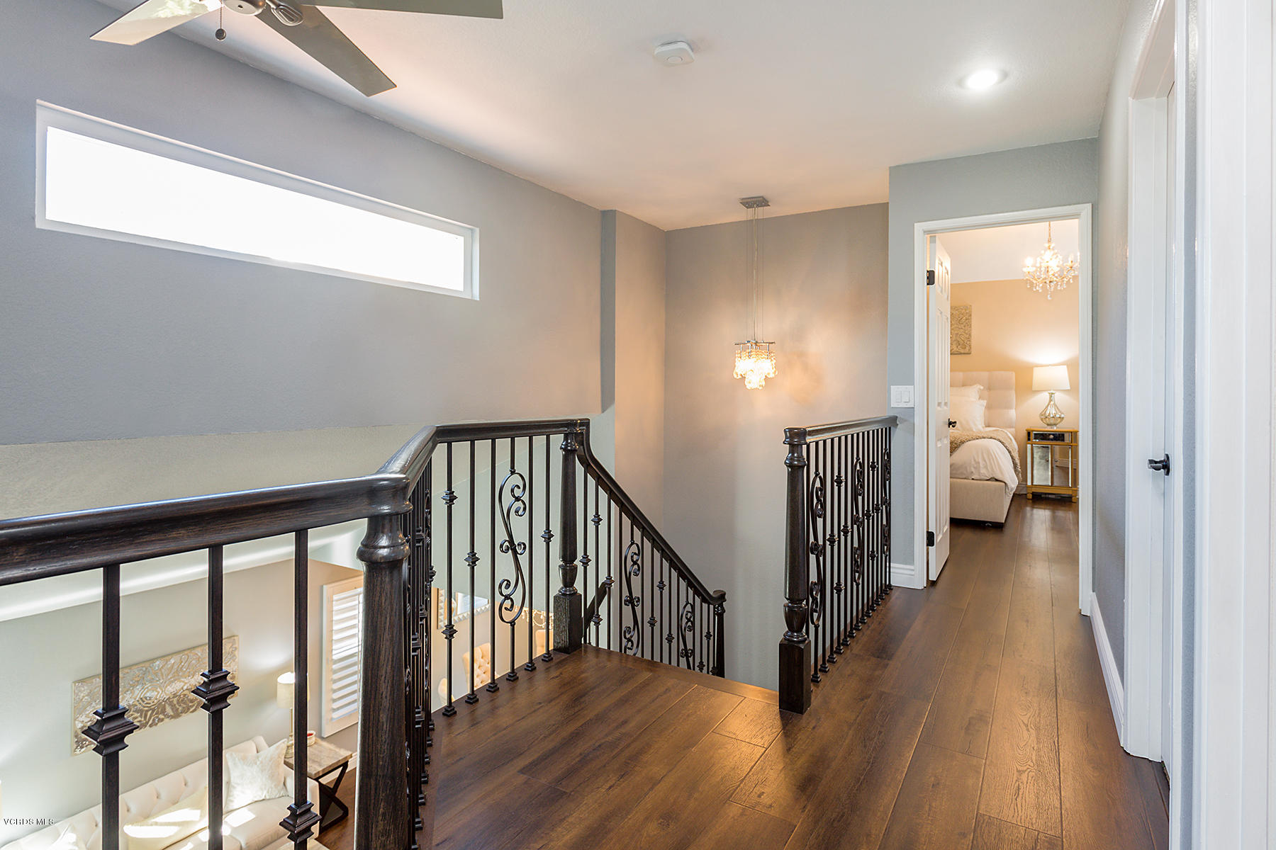 15317 Rains Court Moorpark, CA 93021 - Photo 16 of 34 a view of a hallway with wooden floor and stairs
