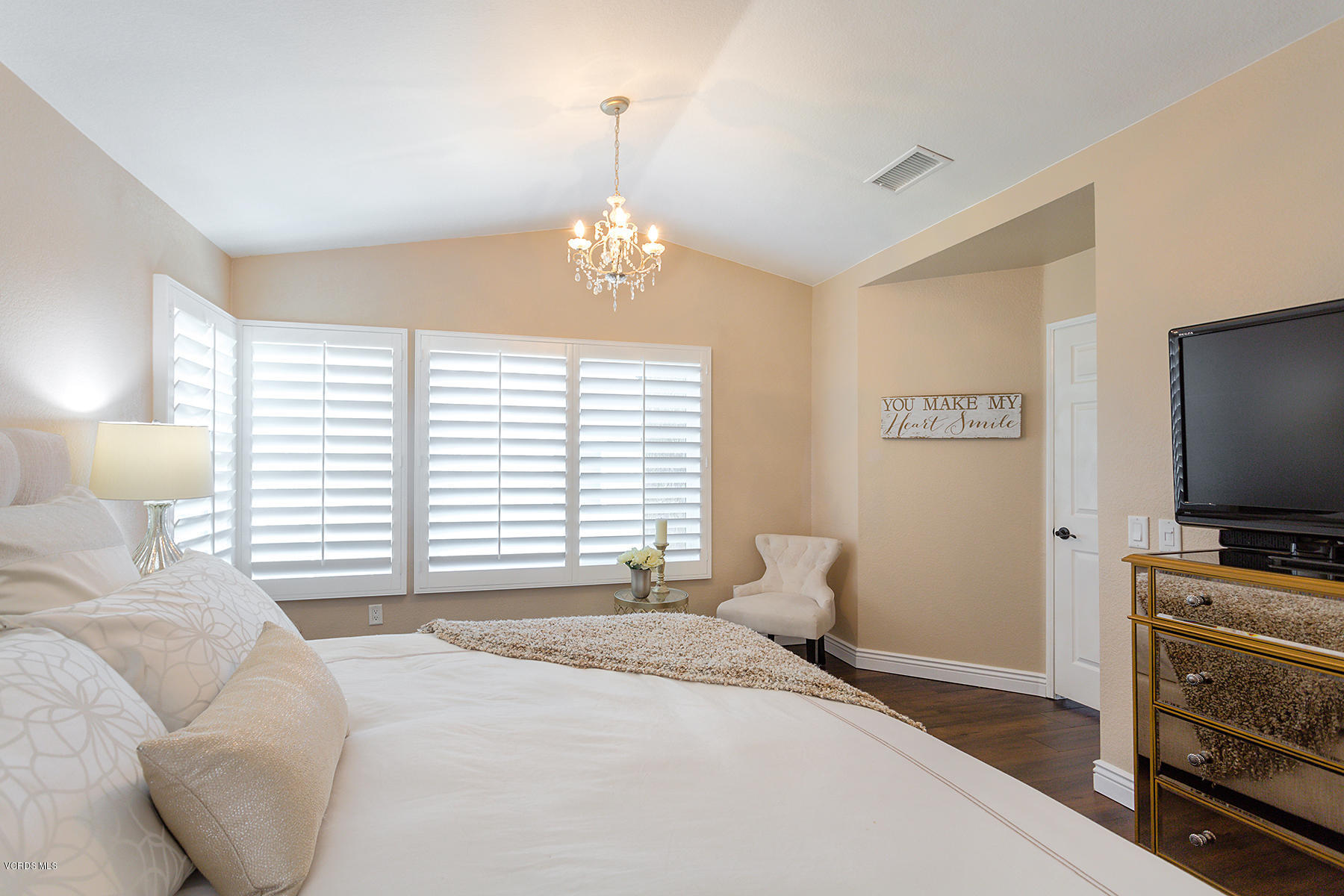 15317 Rains Court Moorpark, CA 93021 - Photo 19 of 34 a bedroom with a bed and a flat screen tv