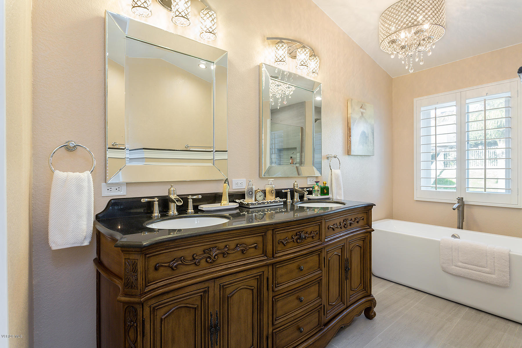 15317 Rains Court Moorpark, CA 93021 - Photo 20 of 34 a bathroom with a sink vanity tub and a mirror