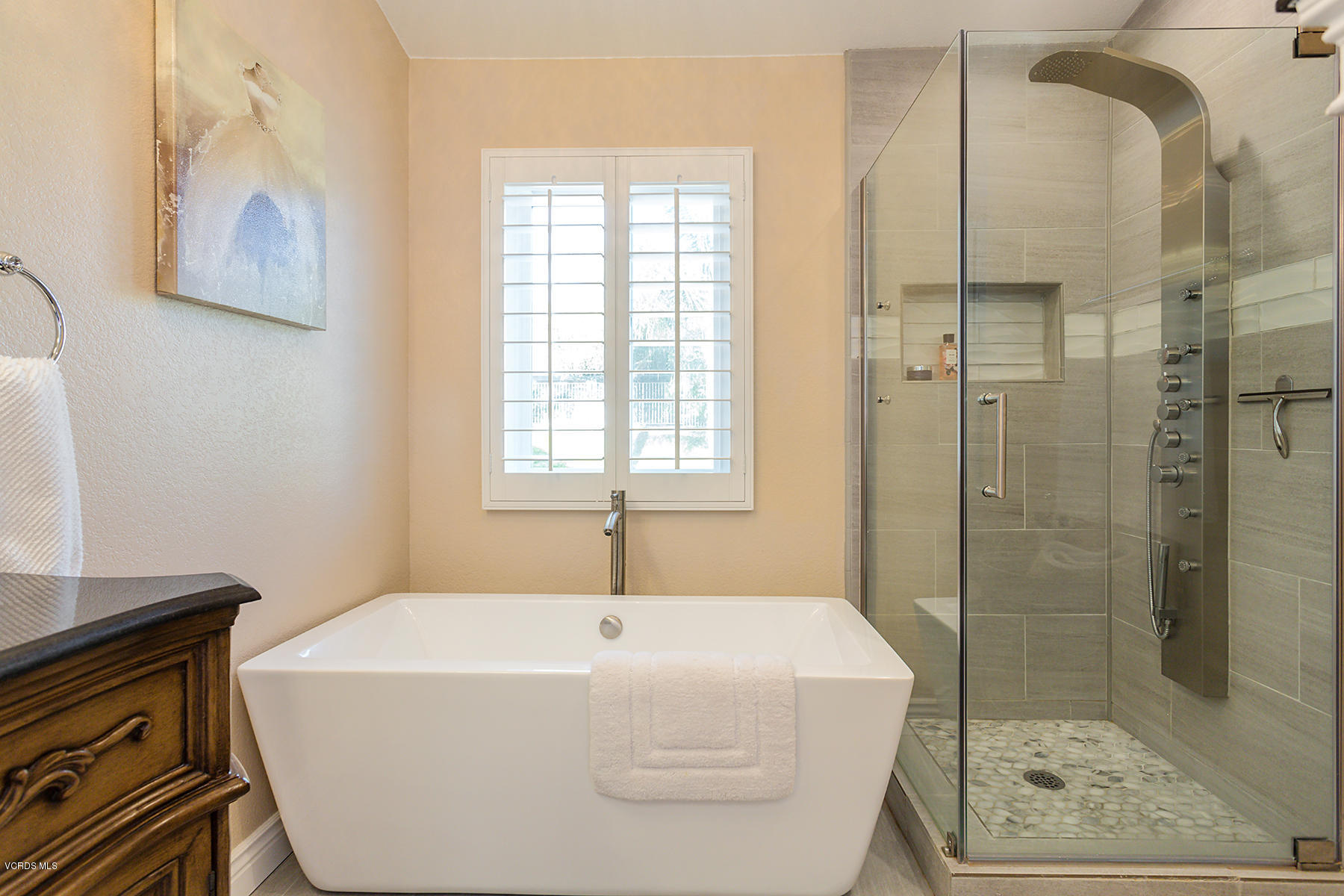 15317 Rains Court Moorpark, CA 93021 - Photo 21 of 34 a spacious bathroom with a bathtub and shower