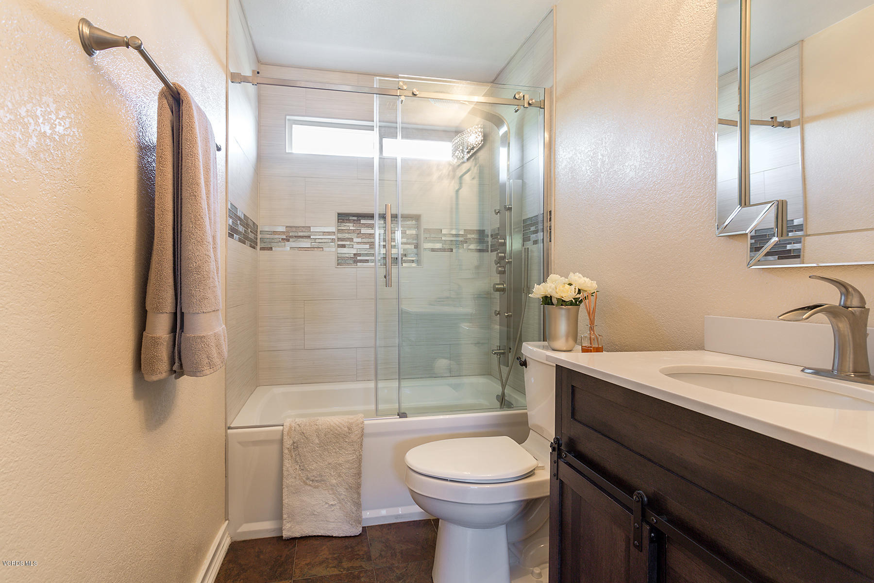 15317 Rains Court Moorpark, CA 93021 - Photo 23 of 34 a bathroom with a sink a toilet and shower