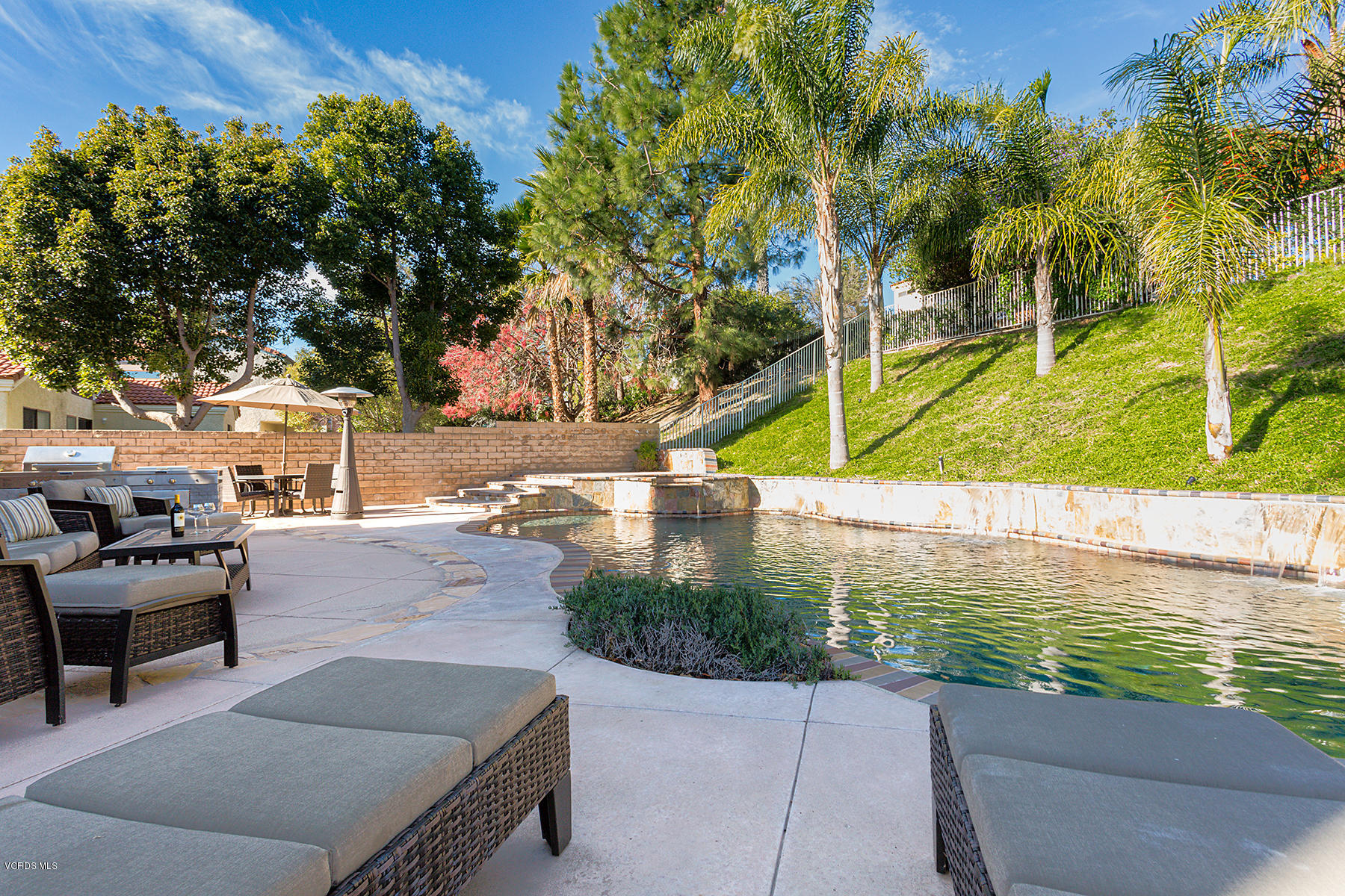 15317 Rains Court Moorpark, CA 93021 - Photo 26 of 34 a view of a swimming pool with a patio
