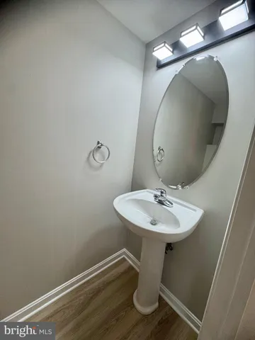 a bathroom with a sink and mirror