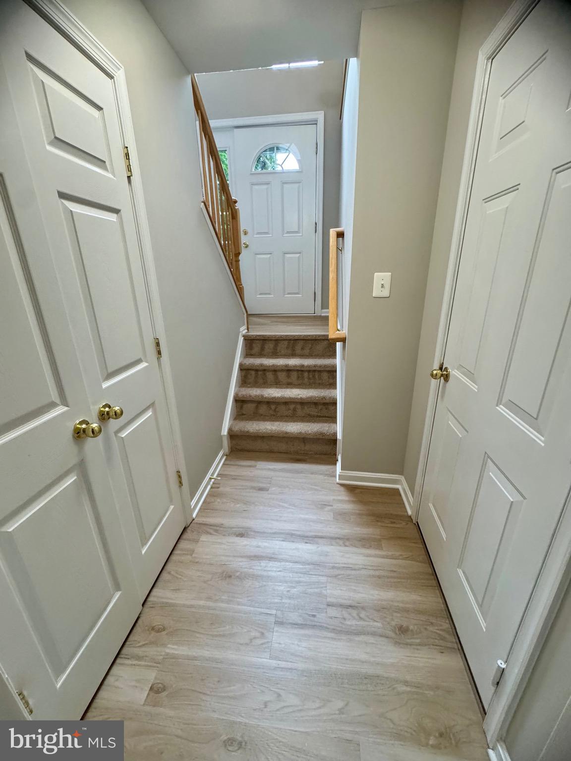 1945 Fieldstone Way Frederick, MD 21702 - Photo 12 of 25 a view of a hallway view with wooden floor and staircase