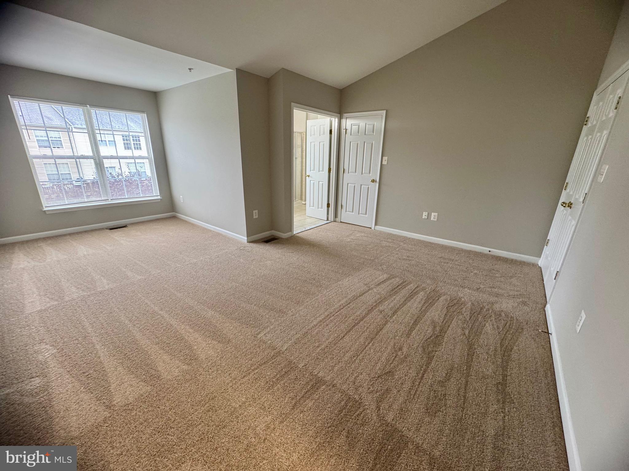 1945 Fieldstone Way Frederick, MD 21702 - Photo 16 of 25 an empty room with windows and closet