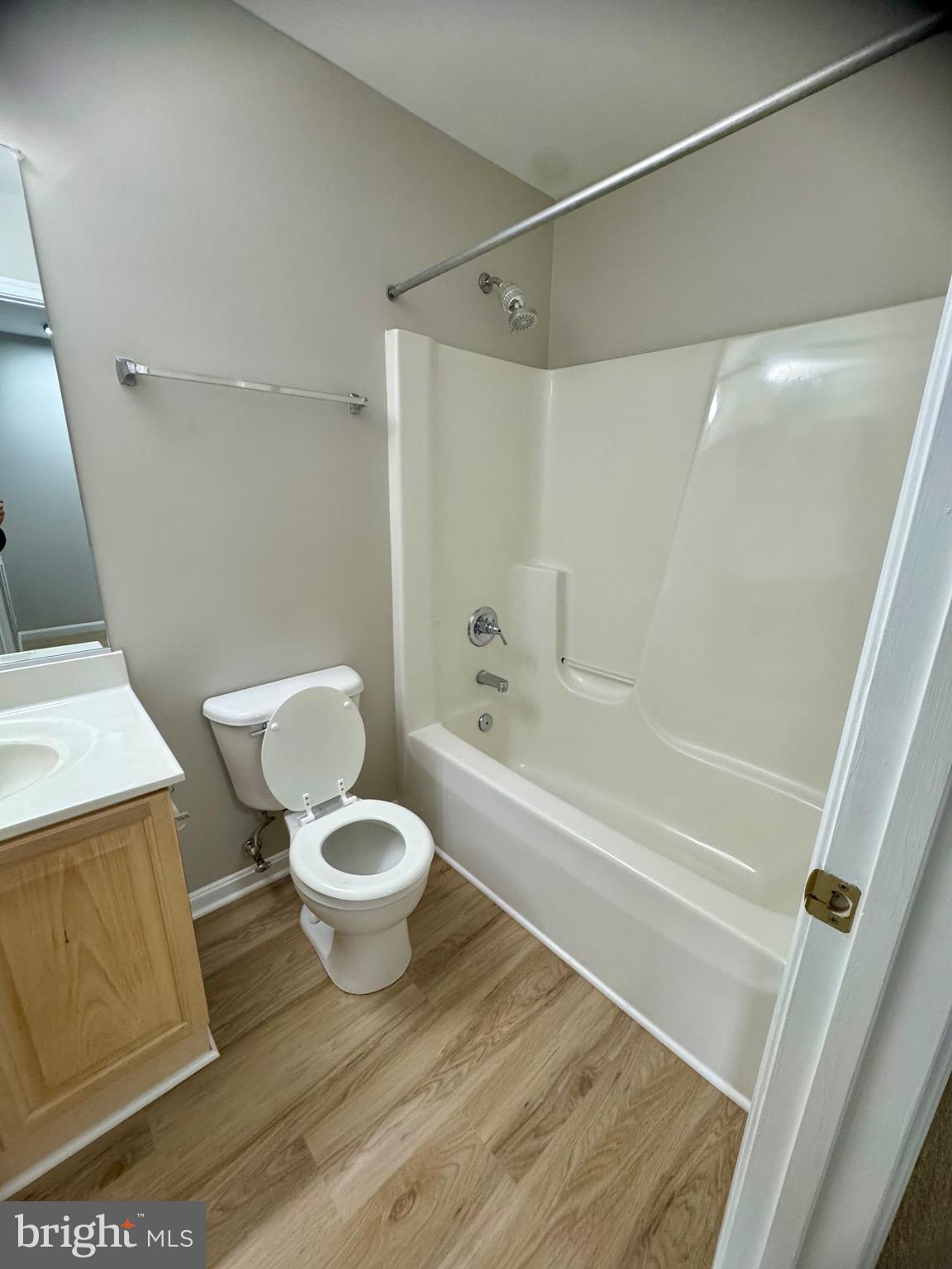 1945 Fieldstone Way Frederick, MD 21702 - Photo 21 of 25 a white toilet sitting next to a bath tub and a shower