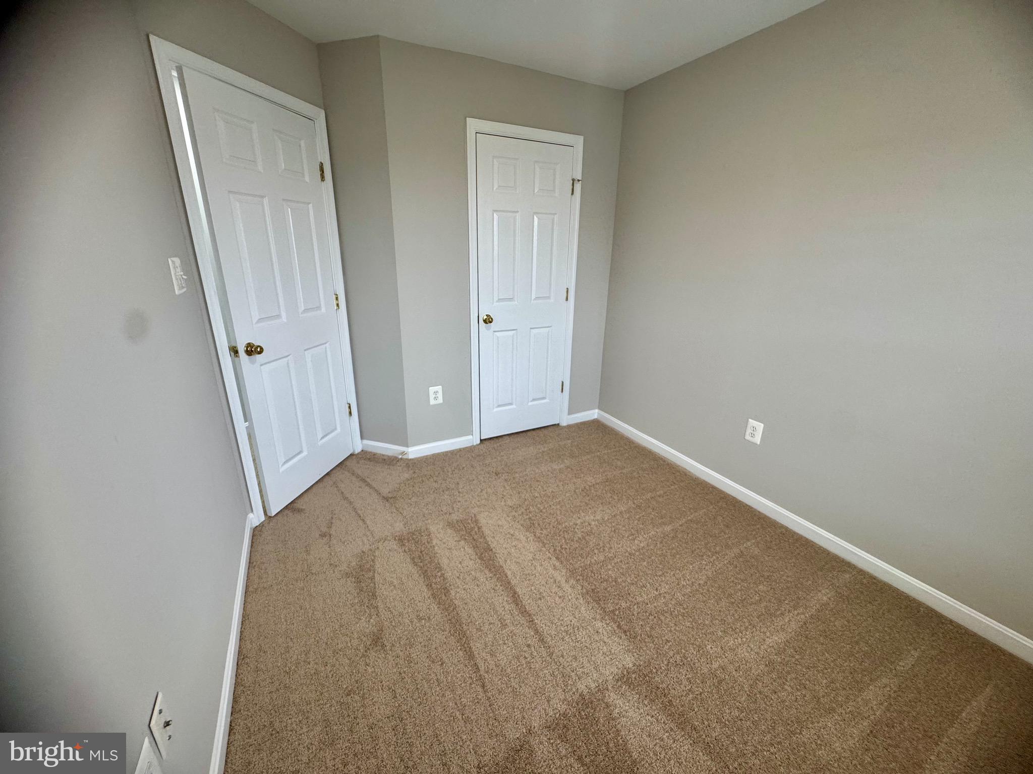 1945 Fieldstone Way Frederick, MD 21702 - Photo 23 of 25 an empty room with a mirror