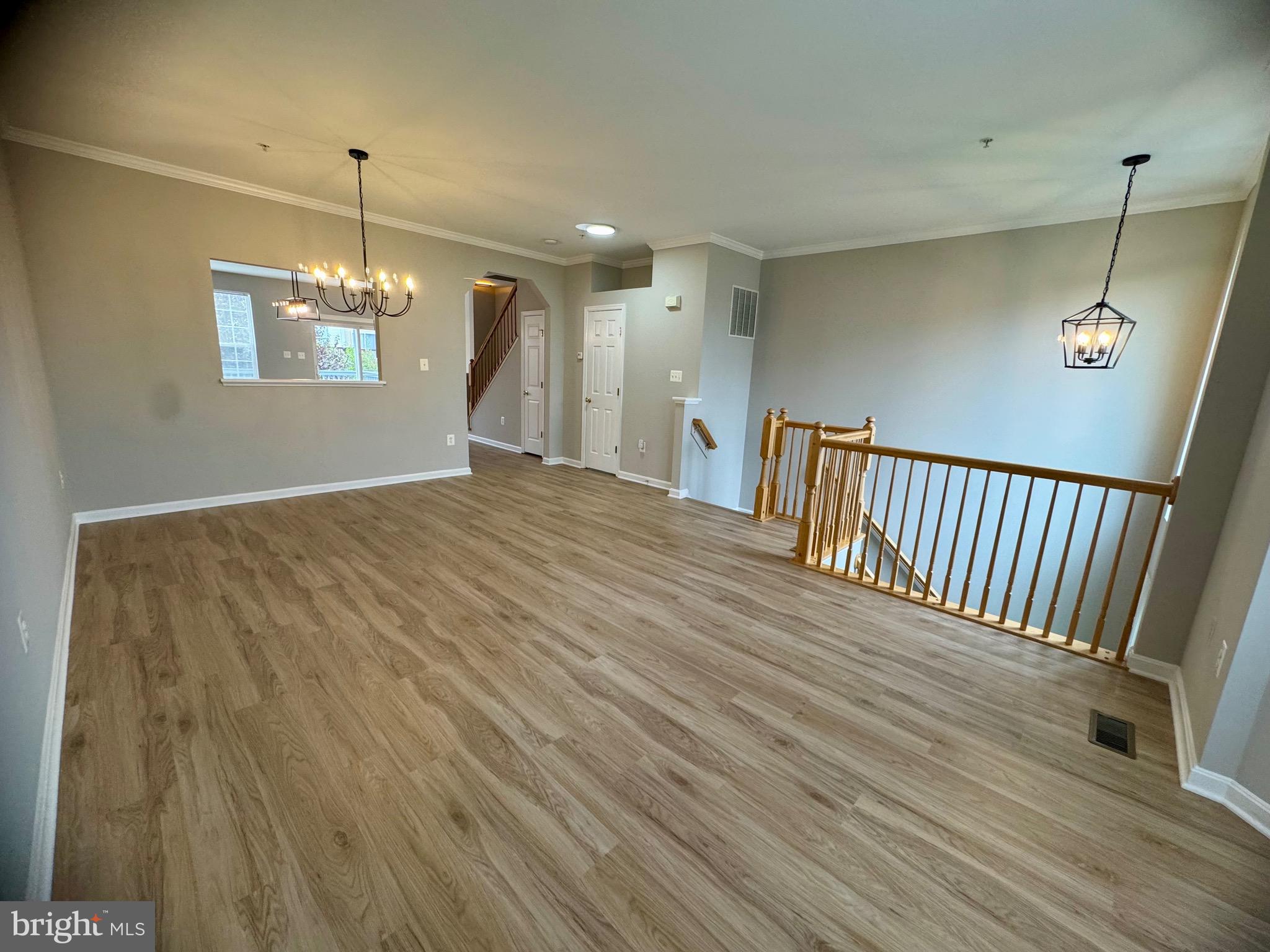 1945 Fieldstone Way Frederick, MD 21702 - Photo 4 of 25 a view of a room with wooden floor fan and window
