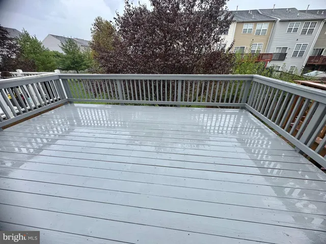 a view of balcony with wooden floor