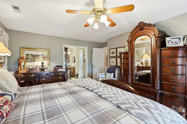 a bathroom with a tub a sink and a shower