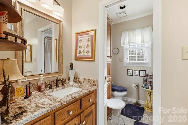 a bedroom with furniture and a chandelier