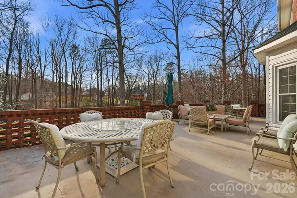 a backyard of apartments with large trees