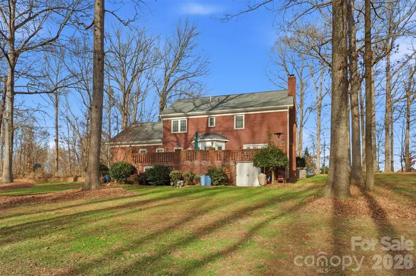 a backyard of apartments with large trees