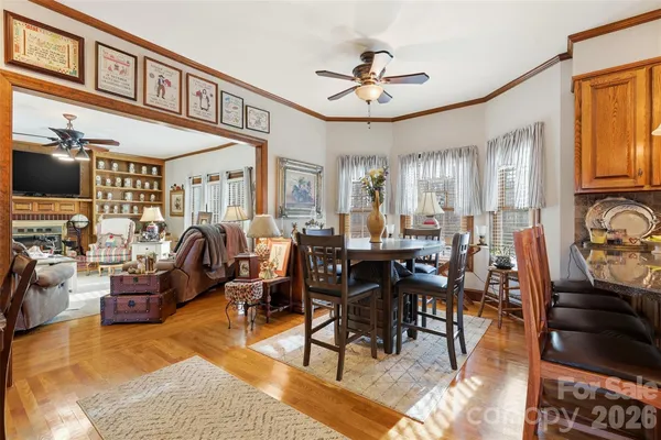 a kitchen with stainless steel appliances kitchen island granite countertop a refrigerator and microwave