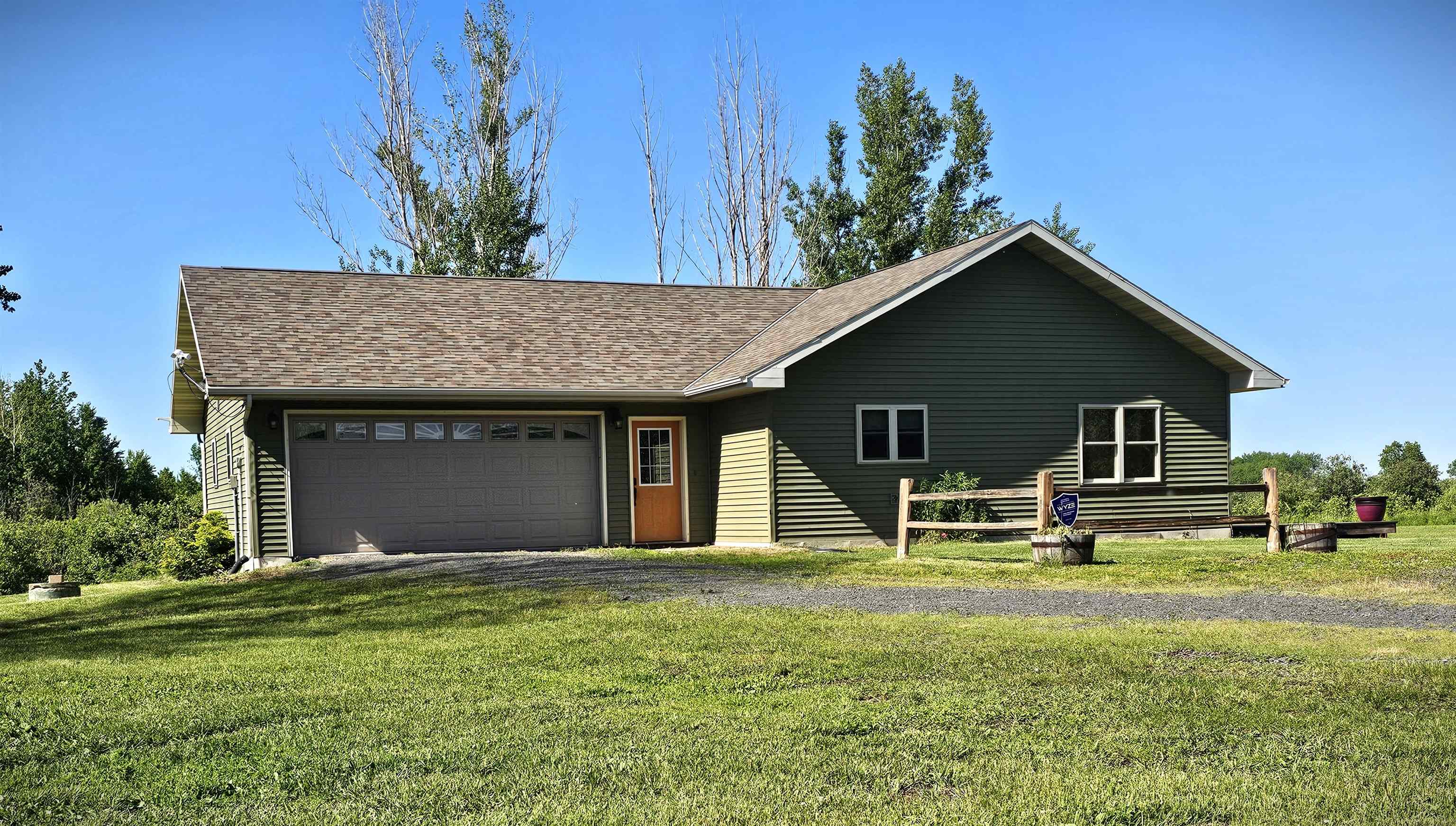 13179 County Rd FF Maple, WI 54854 - Photo 1 of 29 View of front of home featuring an attached garage, a front yard, dirt driveway, and a shingled roof