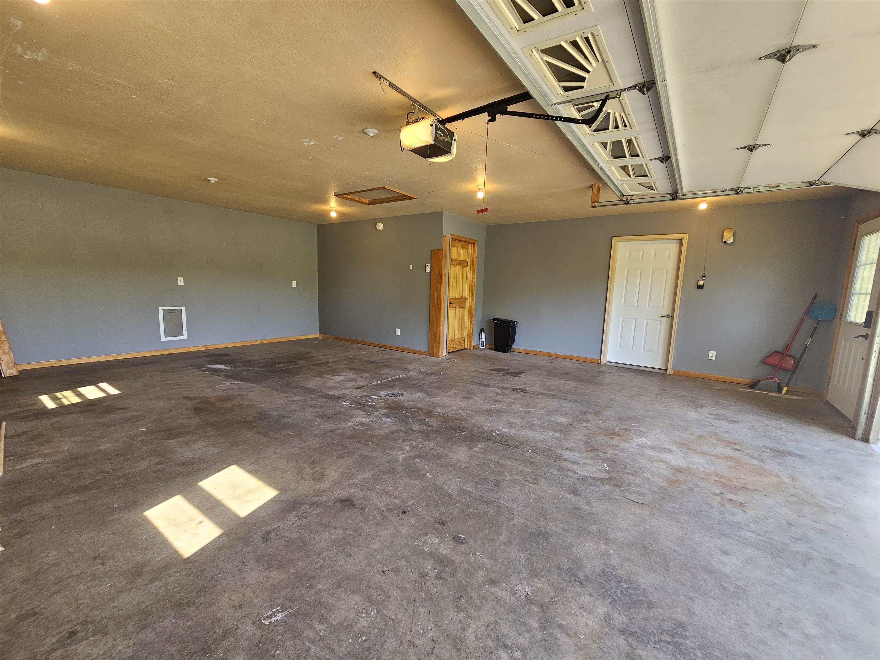13179 County Rd FF Maple, WI 54854 - Photo 25 of 29 Garage with a garage door opener and baseboards