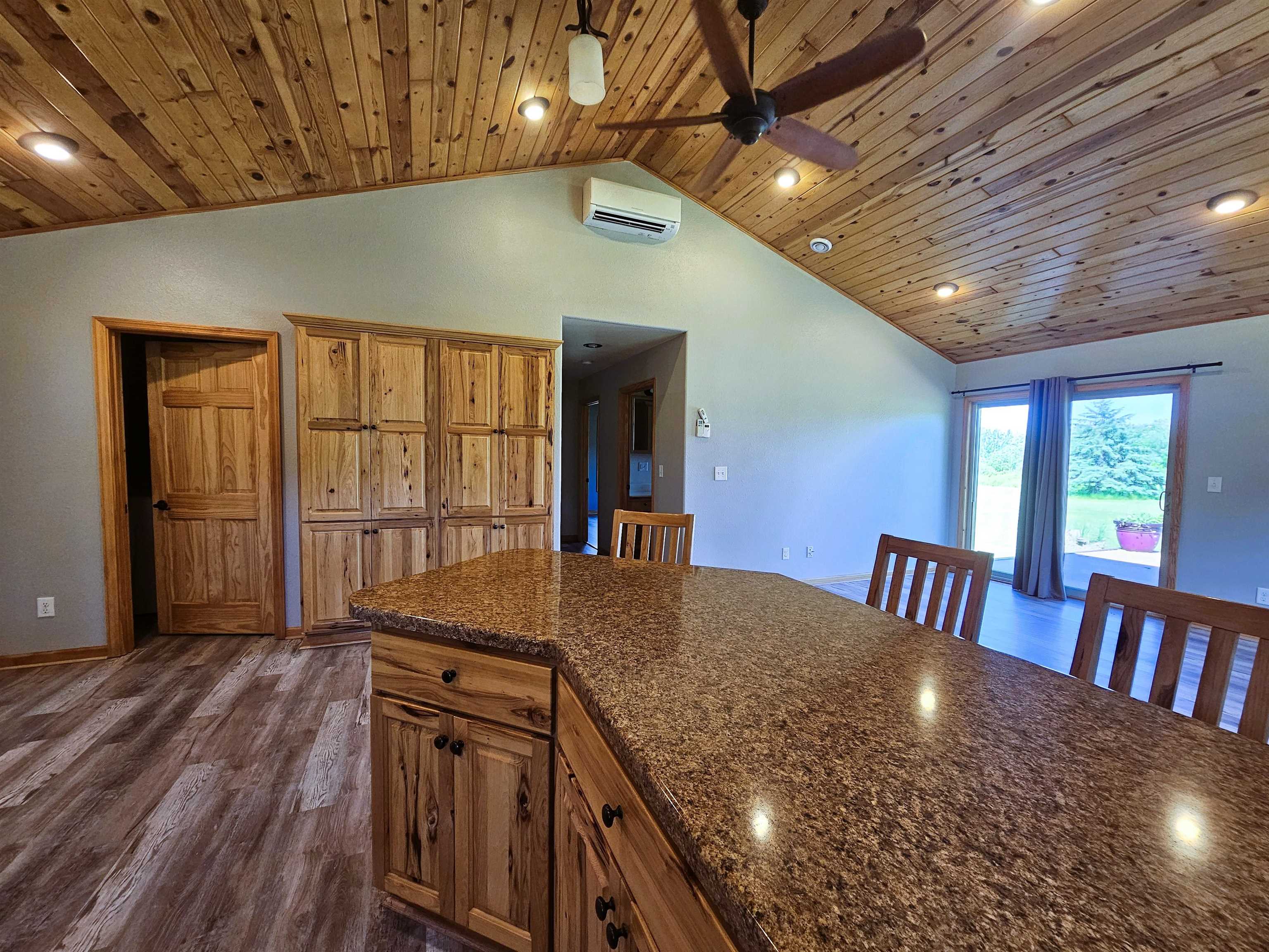 13179 County Rd FF Maple, WI 54854 - Photo 7 of 29 Kitchen with dark countertops, wooden ceiling, ceiling fan, and lofted ceiling