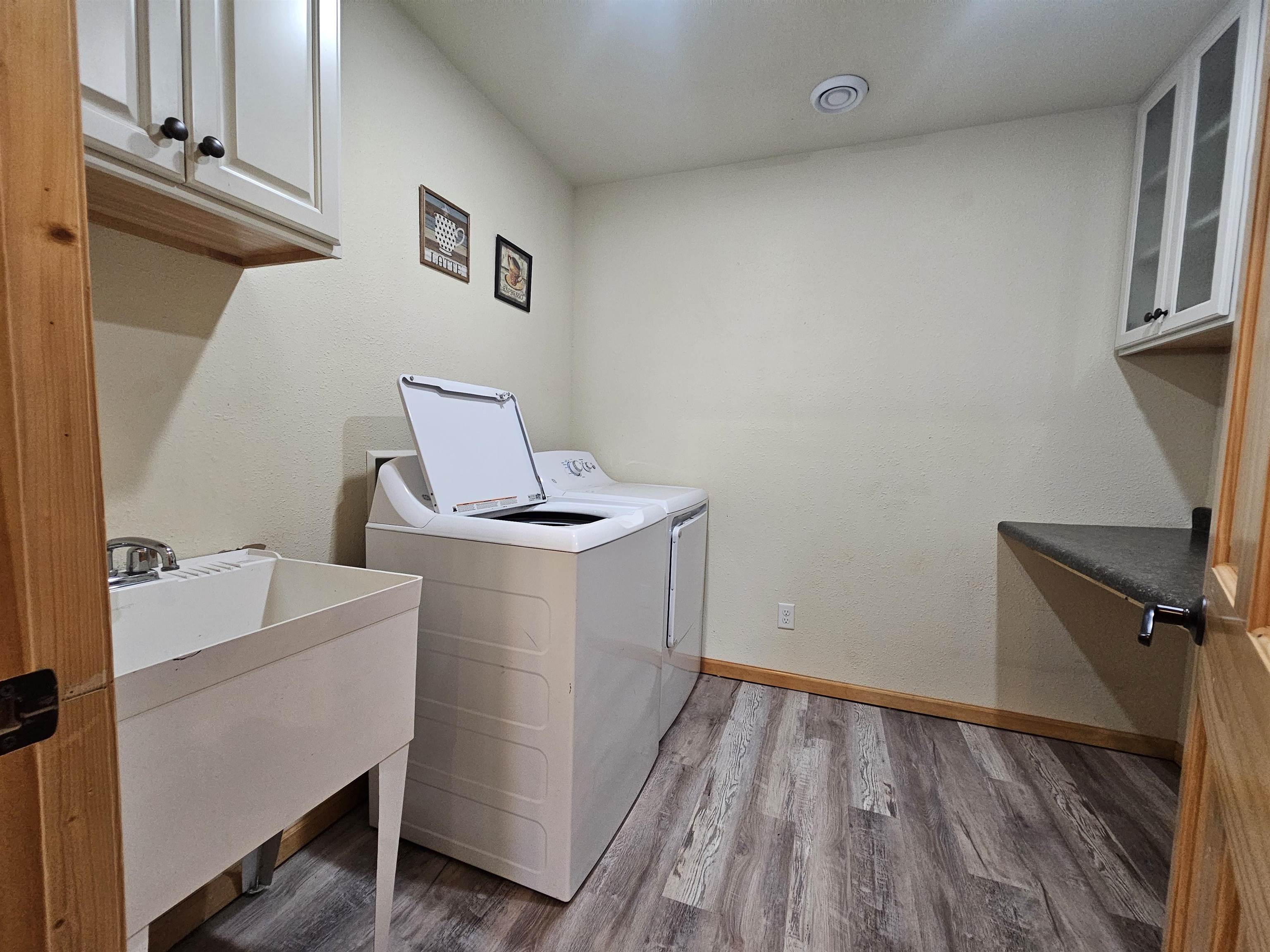 13179 County Rd FF Maple, WI 54854 - Photo 8 of 29 Washroom featuring cabinet space, washer and clothes dryer
