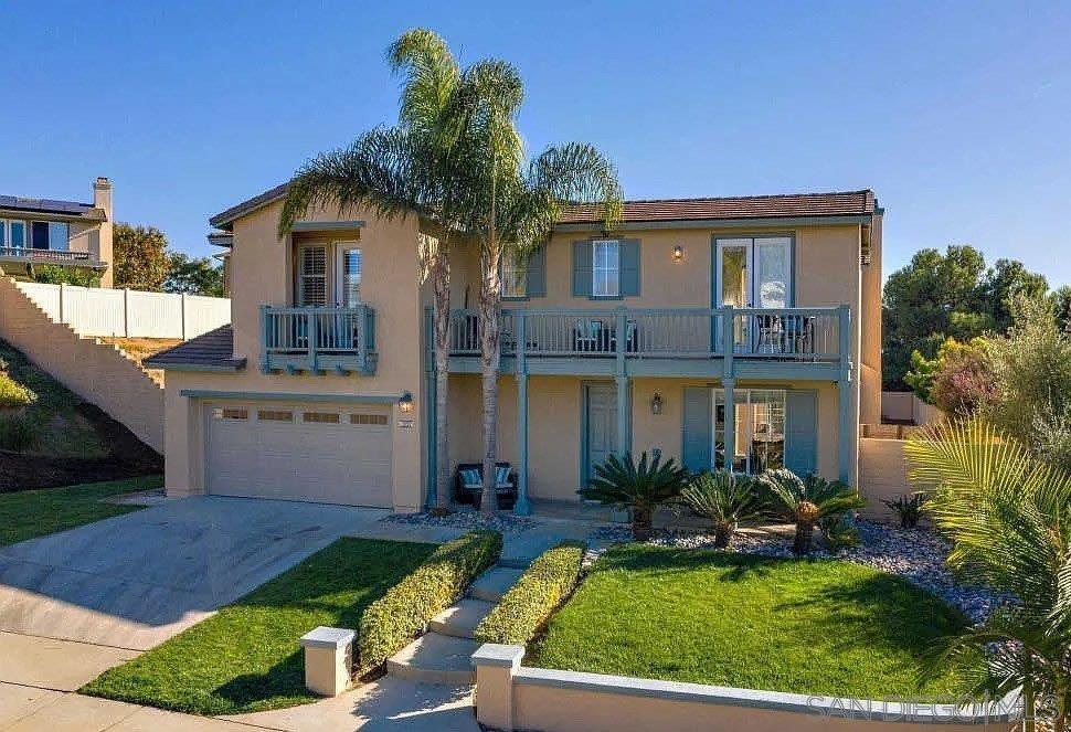 1557 Regatta Road Carlsbad, CA 92011 - Photo 1 of 41 a view of a white house with a yard patio and a fountain