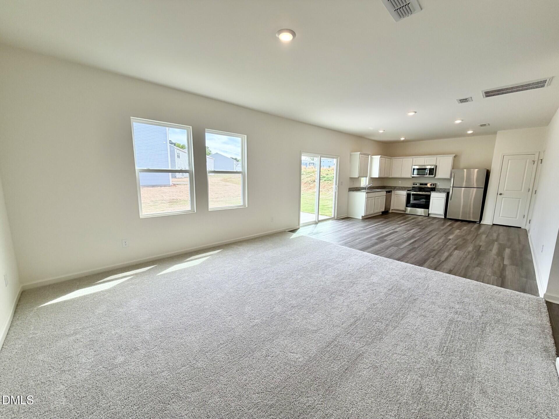 1010 Bombardier Alley Spring Hope, NC 27882 - Photo 12 of 30 a big room with windows and pillars in it
