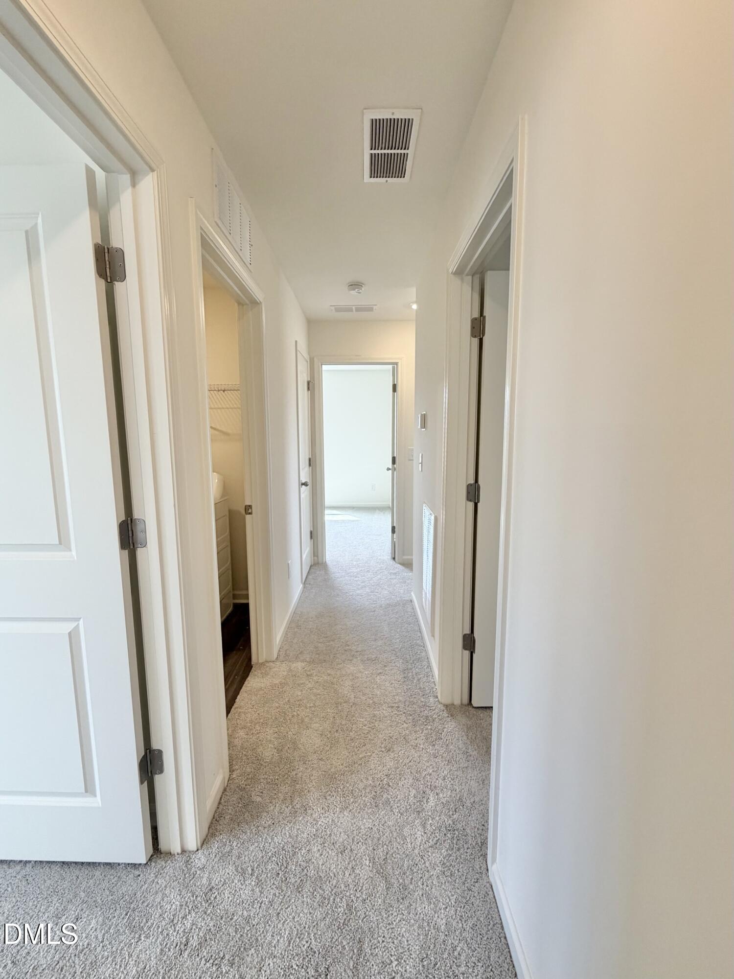 1010 Bombardier Alley Spring Hope, NC 27882 - Photo 15 of 30 a view of a hallway with wooden floor and a hallway