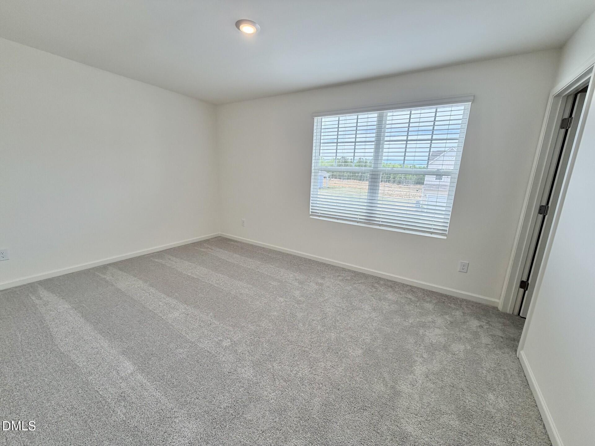 1010 Bombardier Alley Spring Hope, NC 27882 - Photo 19 of 30 an empty room with windows