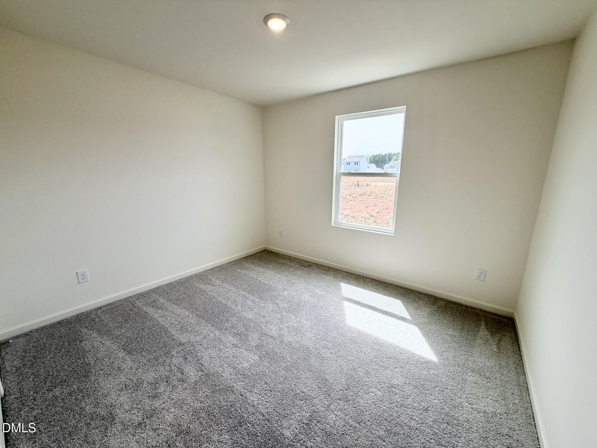 1010 Bombardier Alley Spring Hope, NC 27882 - Photo 23 of 30 an empty room with a window