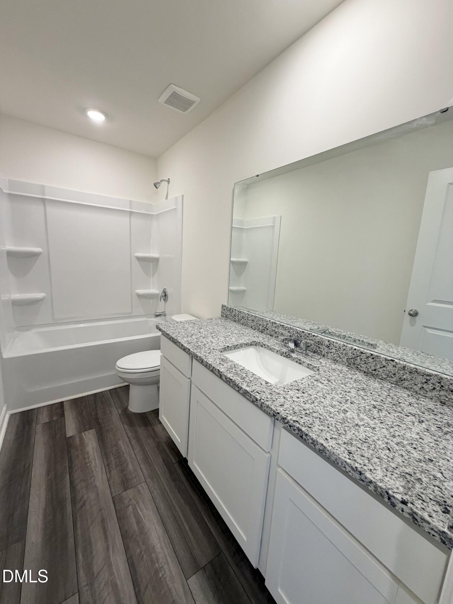 1010 Bombardier Alley Spring Hope, NC 27882 - Photo 24 of 30 a bathroom with a granite countertop sink and a toilet