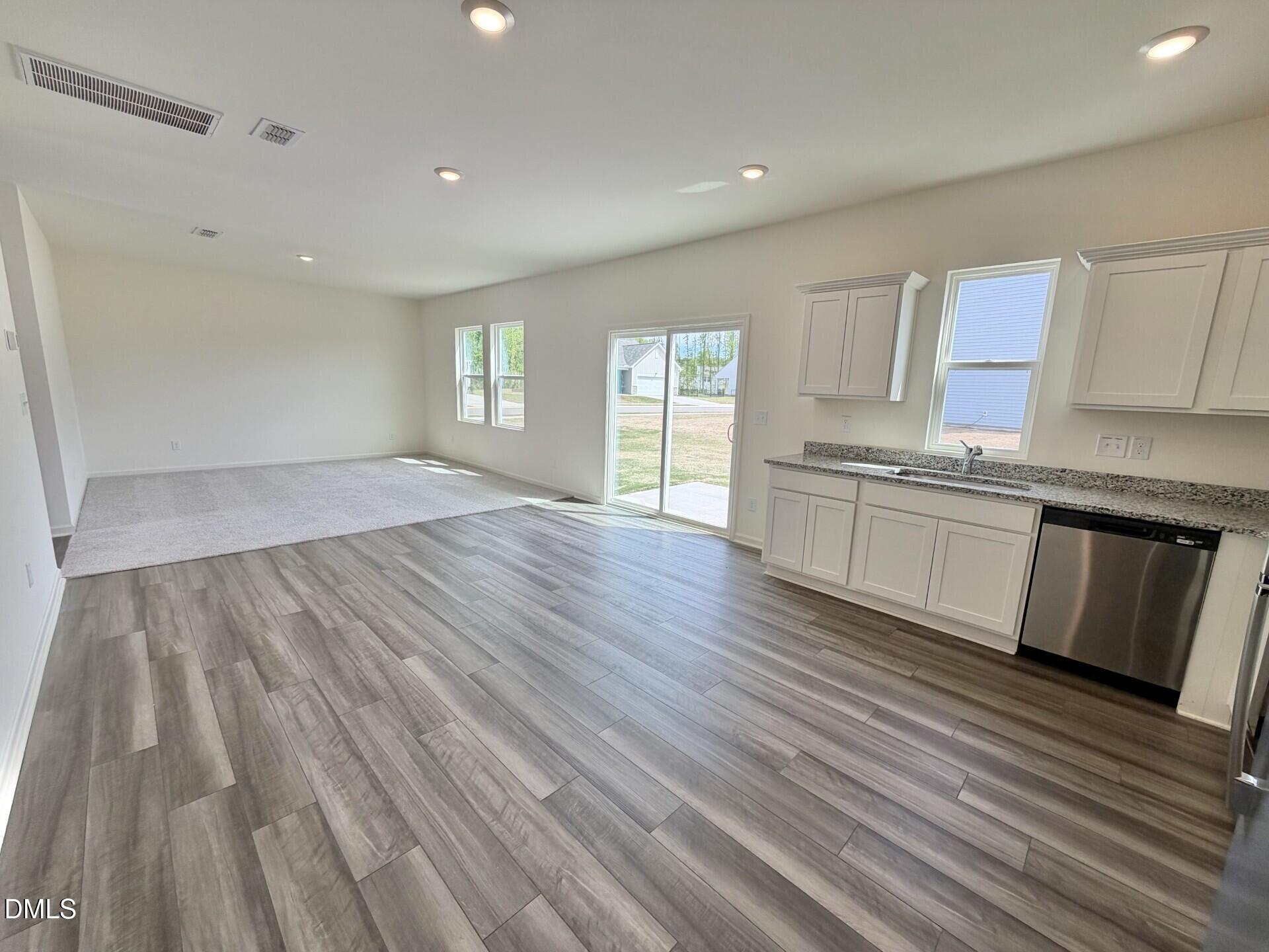 1010 Bombardier Alley Spring Hope, NC 27882 - Photo 8 of 30 a view of a kitchen with wooden floor and electronic appliances