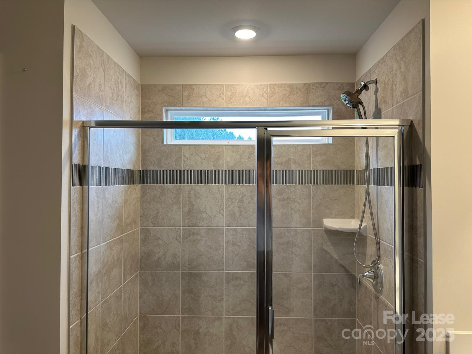 14140 Castle Nook Drive Charlotte, NC 28273 - Photo 12 of 17 a bathroom with a shower