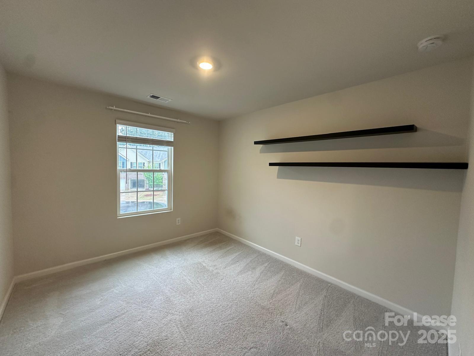 14140 Castle Nook Drive Charlotte, NC 28273 - Photo 13 of 17 a view of an empty room with a window