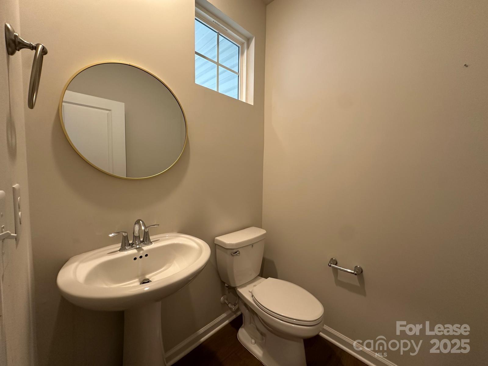 14140 Castle Nook Drive Charlotte, NC 28273 - Photo 7 of 17 a bathroom with a sink mirror and toilet