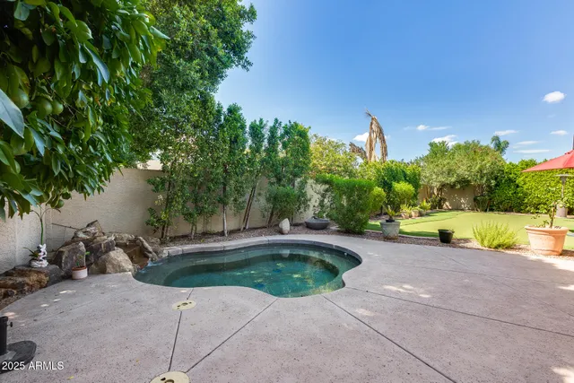 a view of swimming pool with a patio