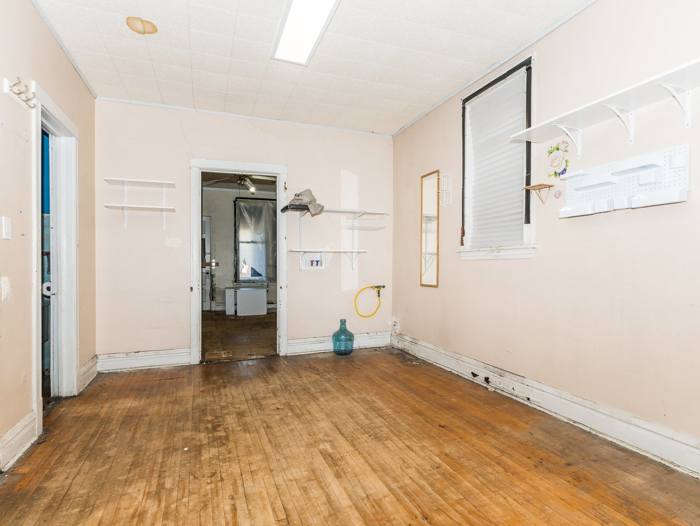 1818 West 46th Street Chicago, IL 60609 - Photo 11 of 14 a view of empty room with wooden floor and cabinet