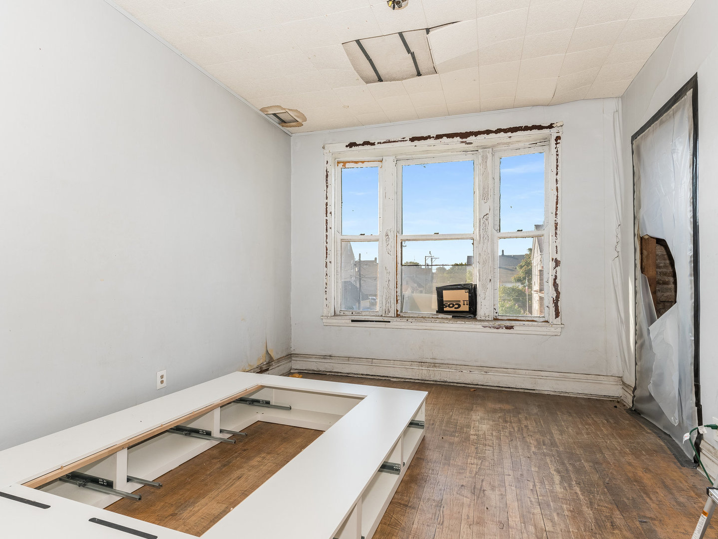1818 West 46th Street Chicago, IL 60609 - Photo 3 of 14 a room with window and a wooden floor