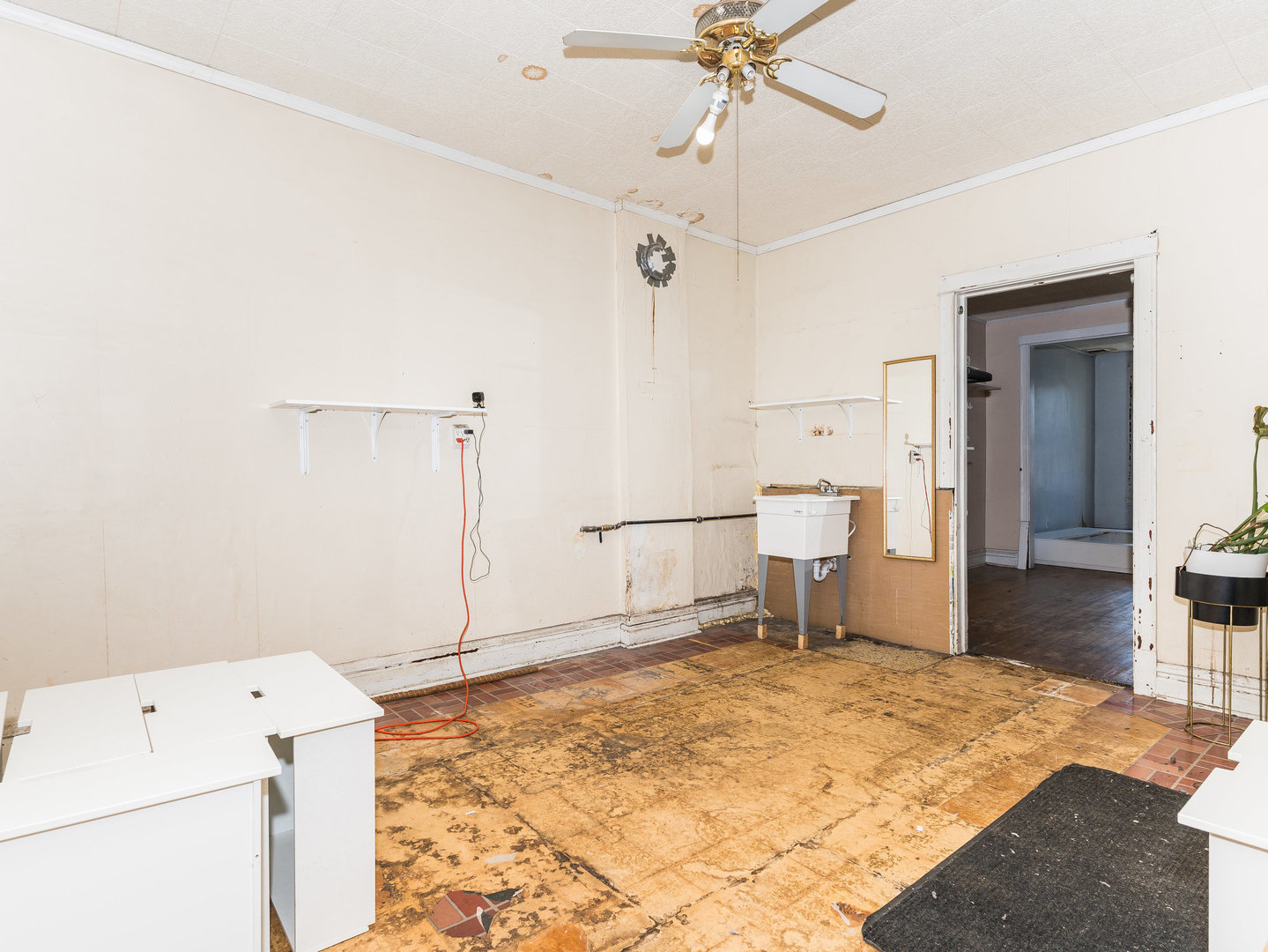 1818 West 46th Street Chicago, IL 60609 - Photo 6 of 14 a bedroom with a bed and a chandelier