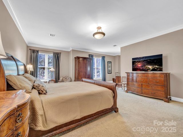 a bedroom with a bed and furniture