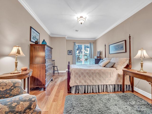 a bed room with a bed and a lamp