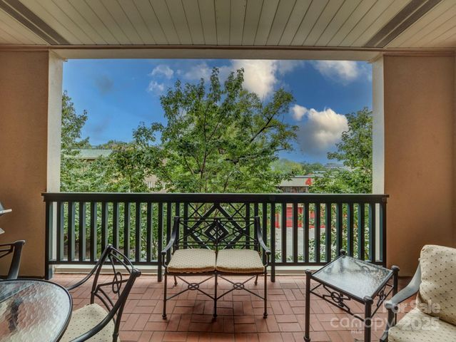 a view of a chairs and table in patio