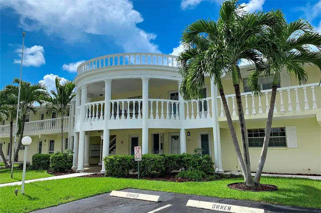 a swimming pool with outdoor seating and yard