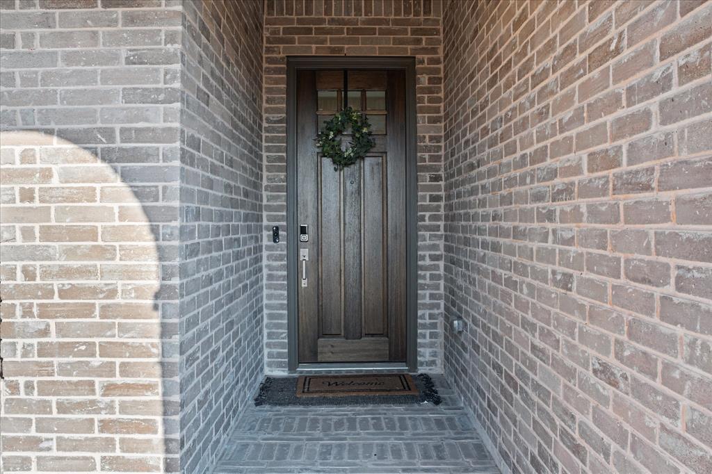 1332 Thompson Road Argyle, TX 76226 - Photo 4 of 36 Doorway to property with brick siding
