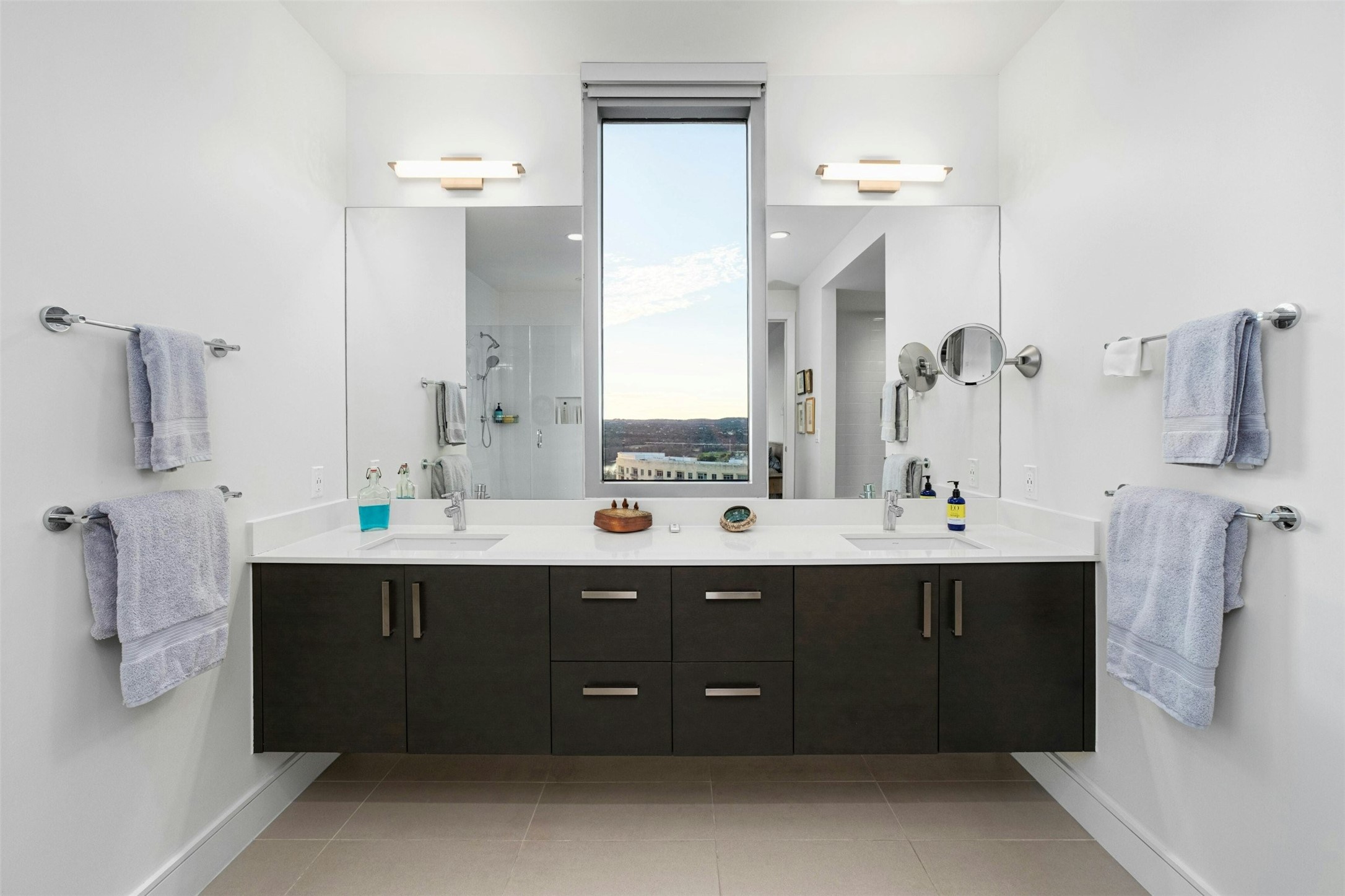 222 West Avenue, Unit 2201 Austin, TX 78701 - Photo 15 of 37 a bathroom with a double vanity sink mirror and shower