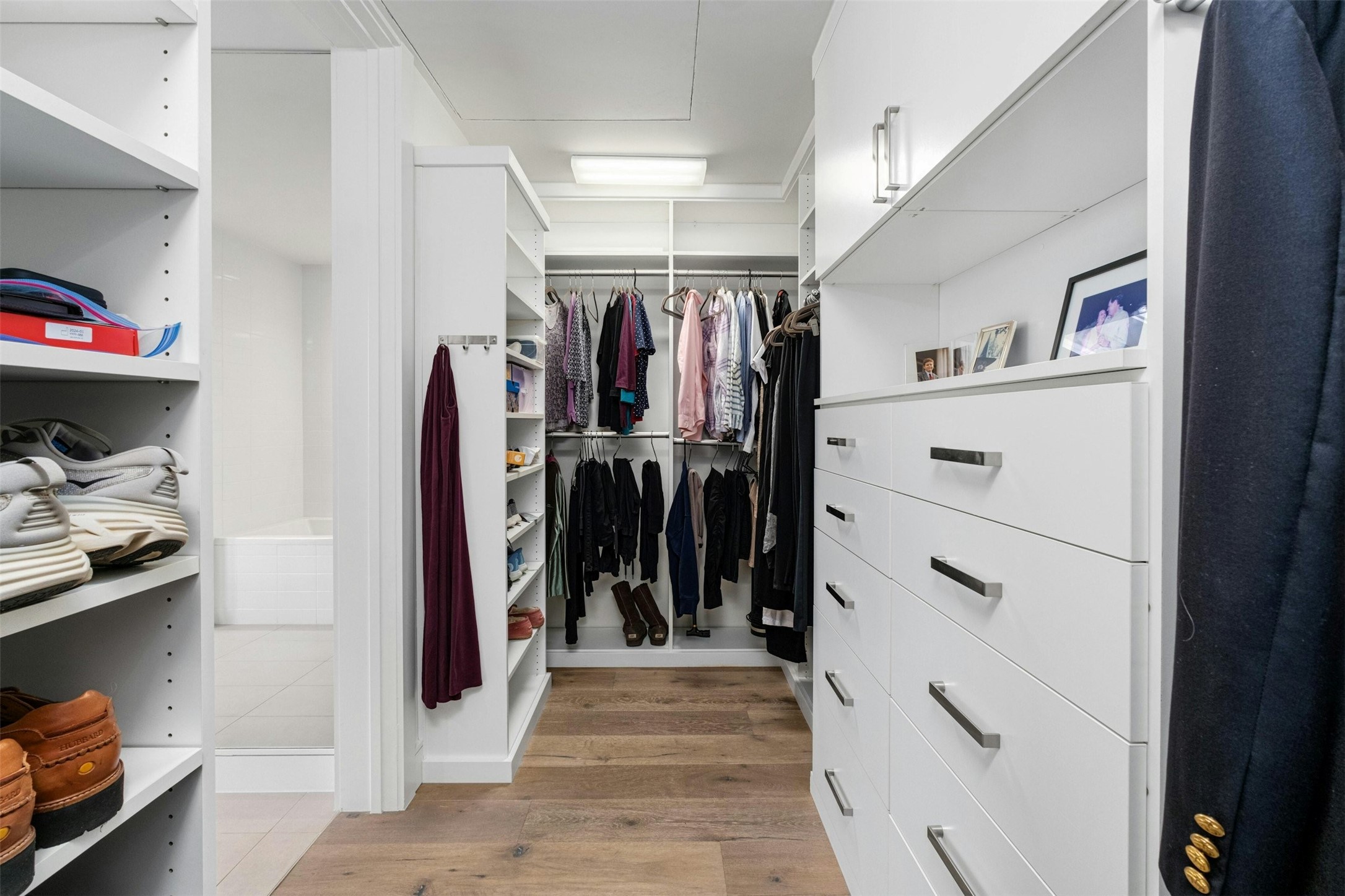 222 West Avenue, Unit 2201 Austin, TX 78701 - Photo 17 of 37 a view of walk in closet with clothes and shoes