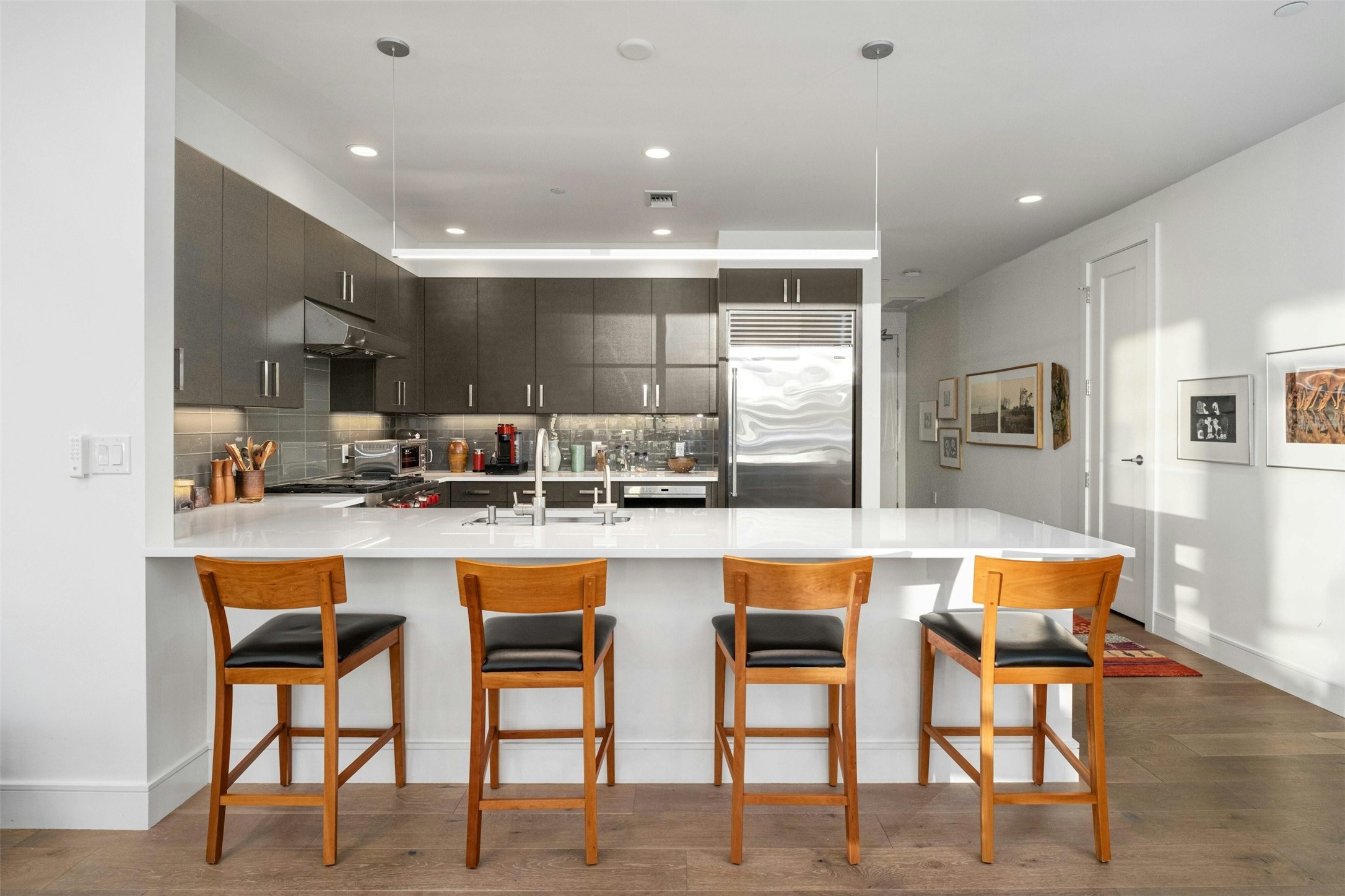 222 West Avenue, Unit 2201 Austin, TX 78701 - Photo 5 of 37 a large kitchen with a table and chairs