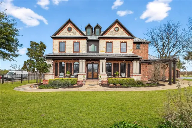 a front view of a house with garden
