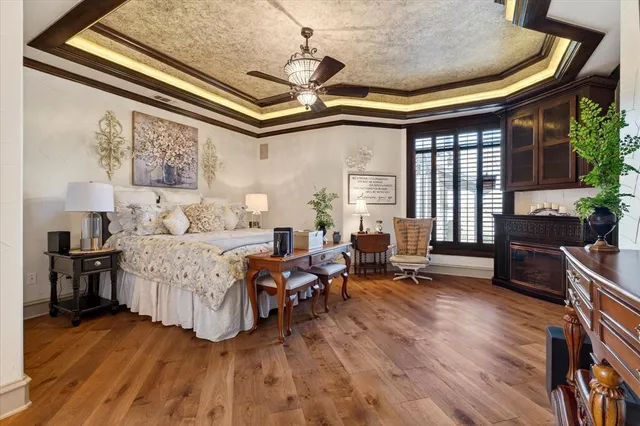 a spacious bathroom with a bathtub sink and mirror