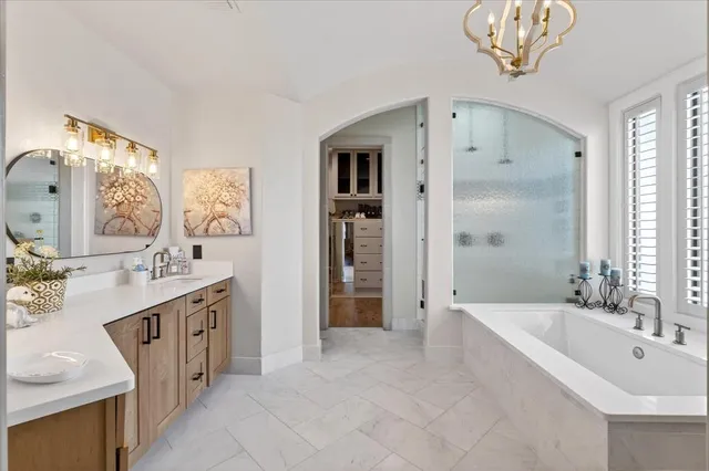 a spacious bathroom with a double vanity sink and a mirror