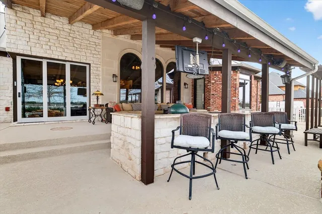 a front view of a house with swimming pool yard and outdoor seating