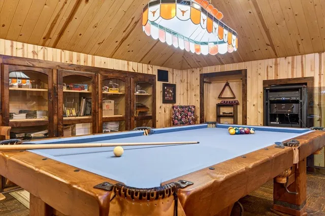 a view of an chairs and table in a room